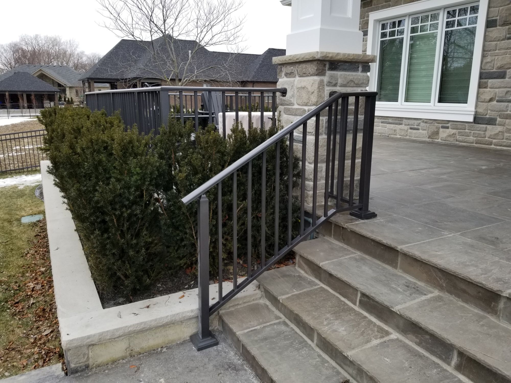 Another shot of the railing job we did on Houston in Kingsville. Customer built continuous stair railing that turns back to the stone column.